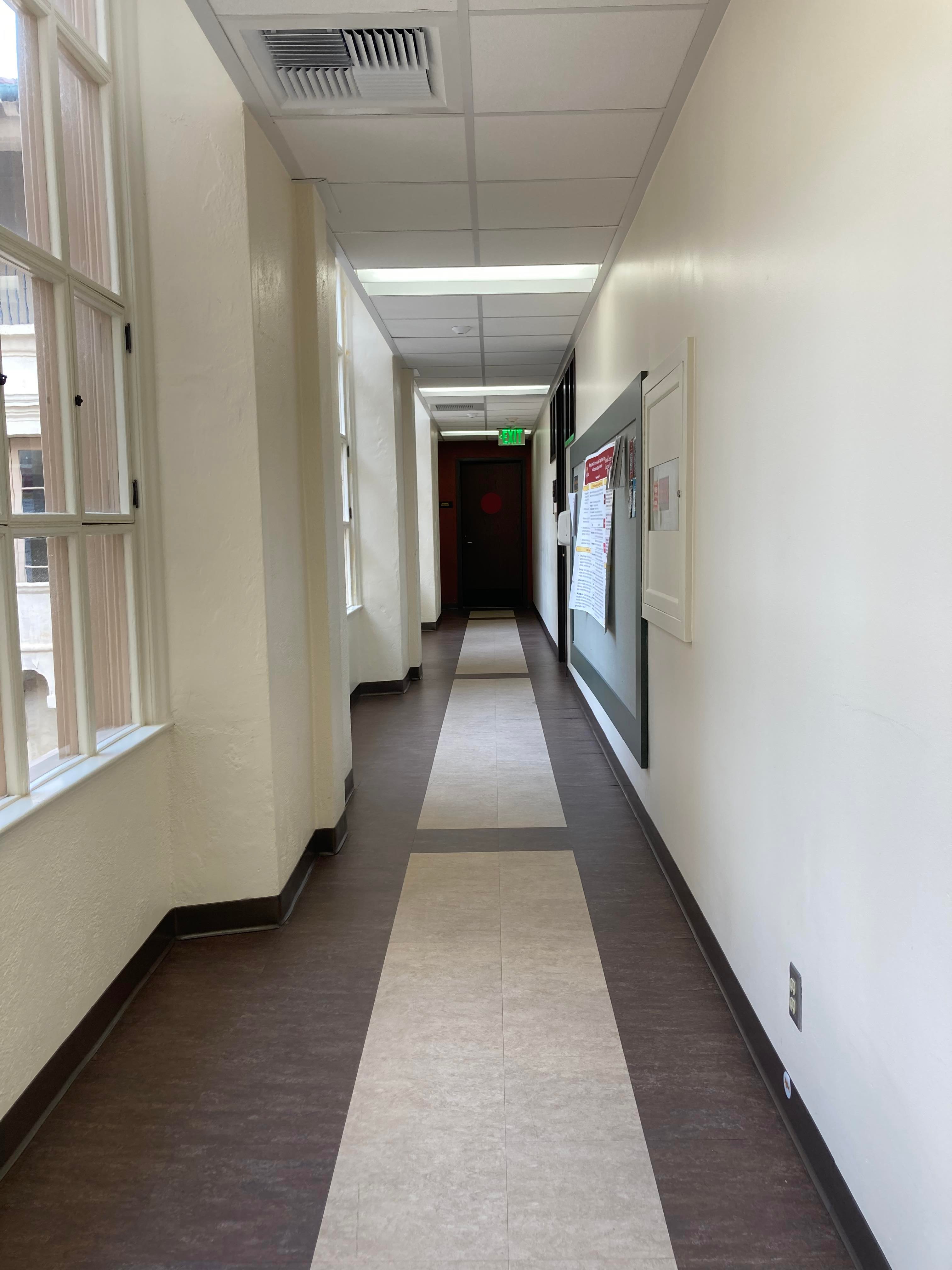 After passing the door frame, turn left again and go down the hallway