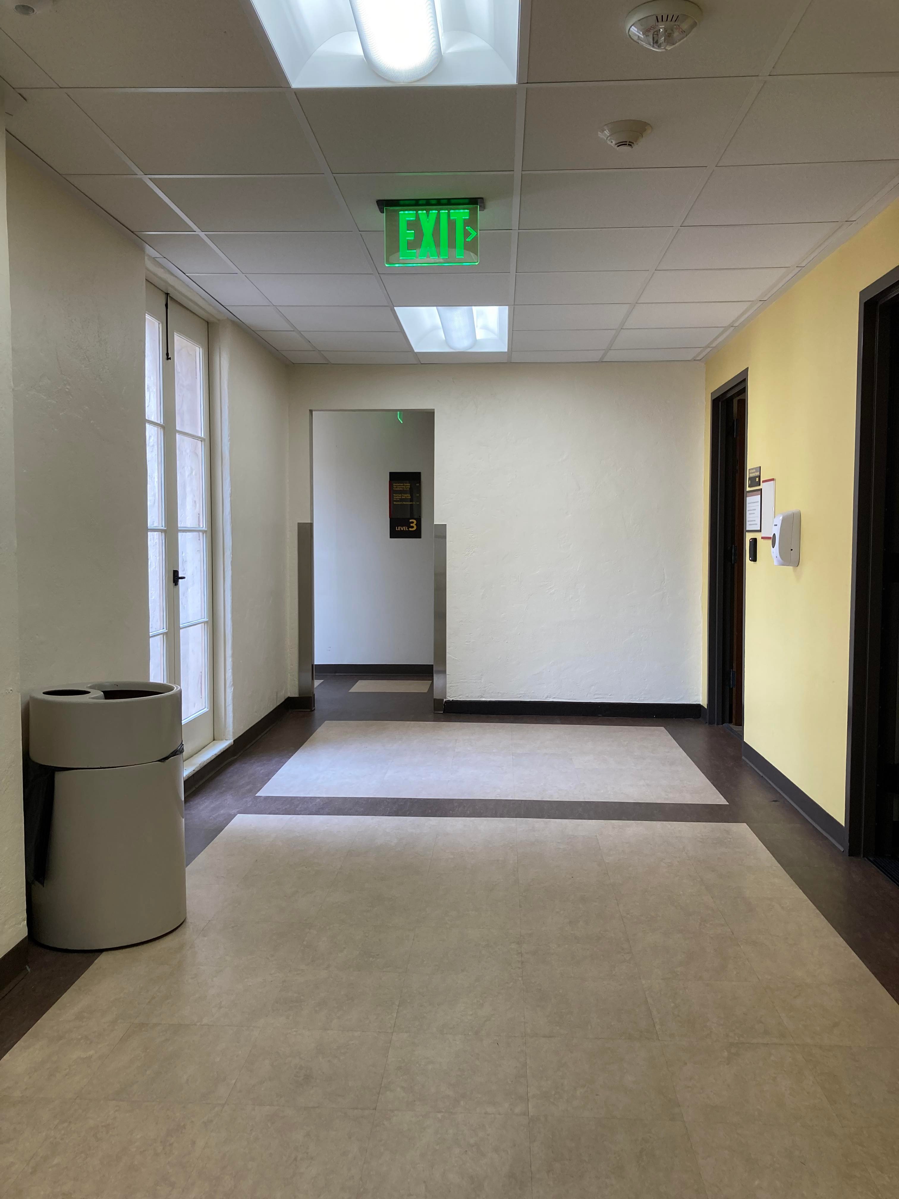 Get out of the elevator, turn left, and pass the door frame