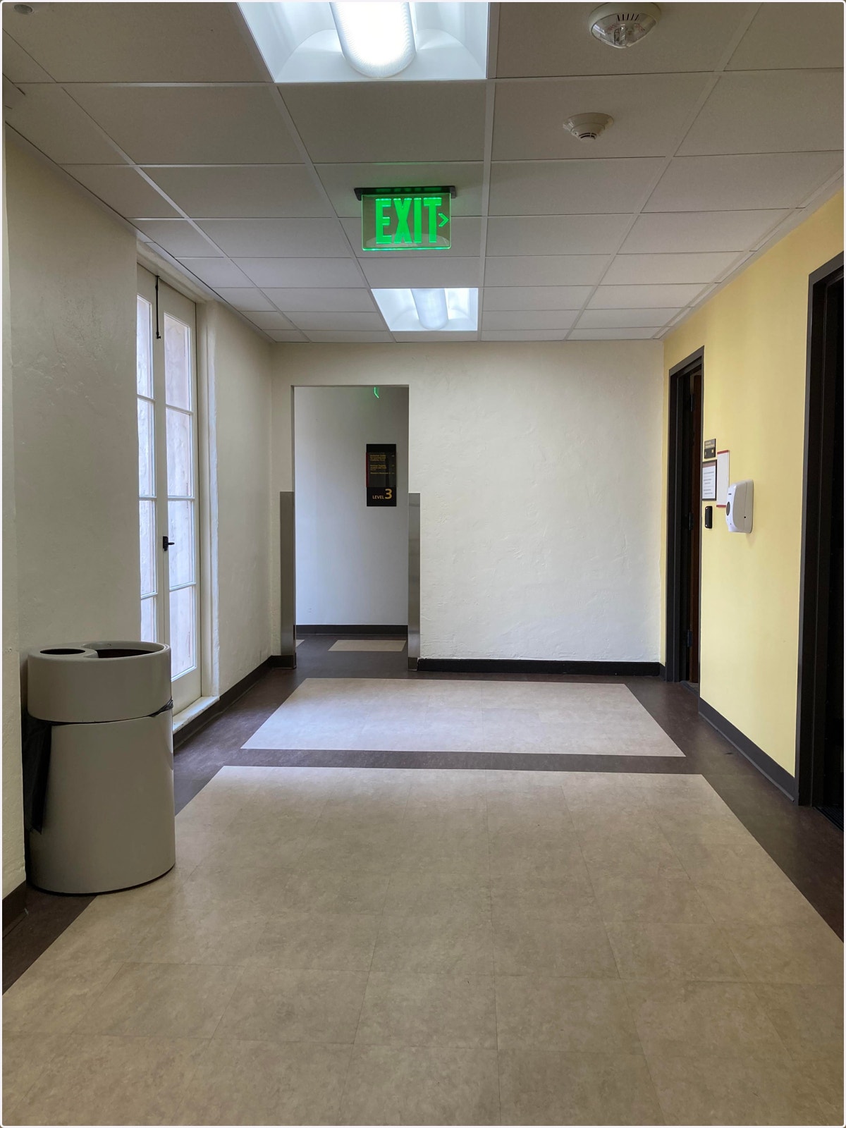 Get out of the elevator, turn left, and pass the door frame