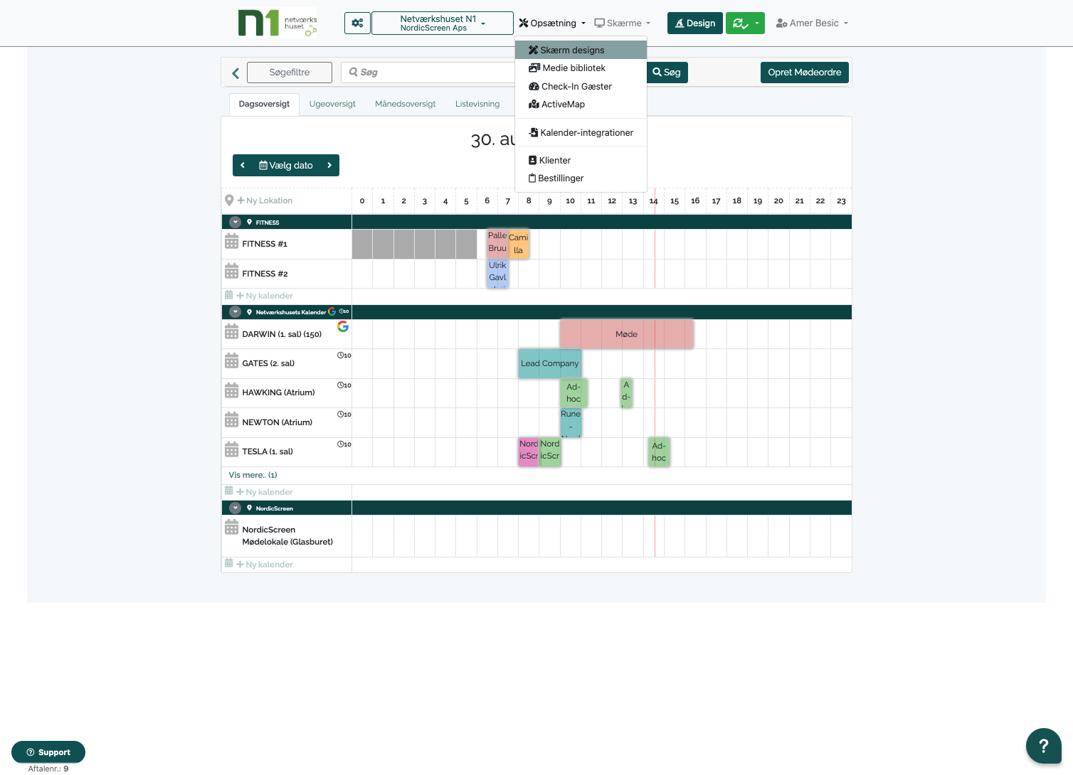 Q-Cal interface showing calendar view with bookings and navigation tabs for main menu, design, and screen designs options.