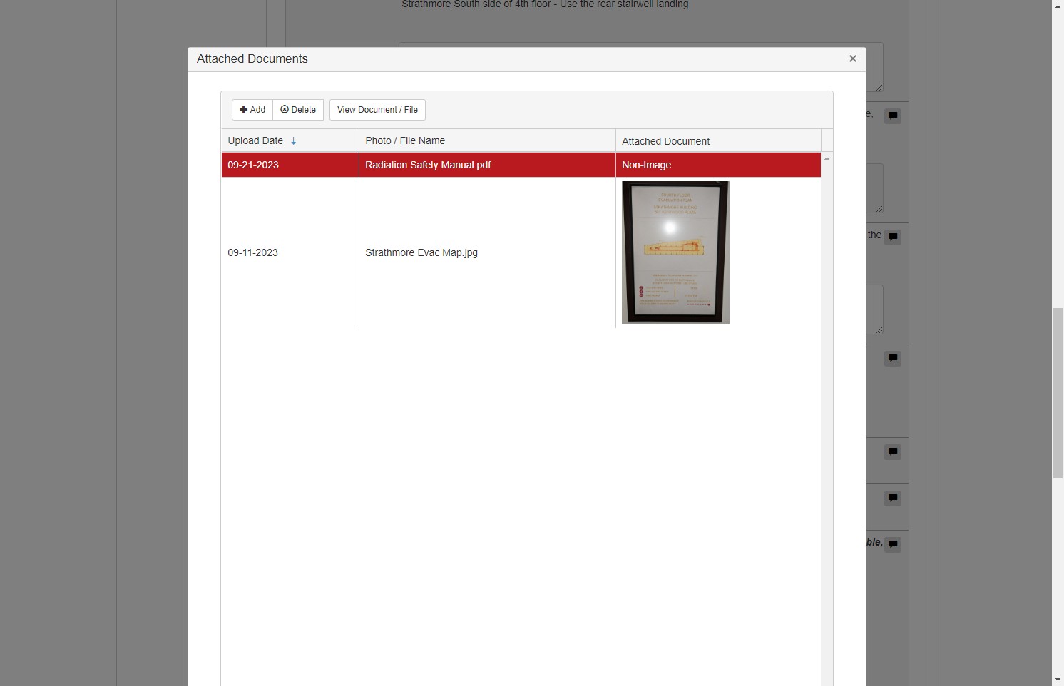 The new photo/file should now appear in the table of attached documents.